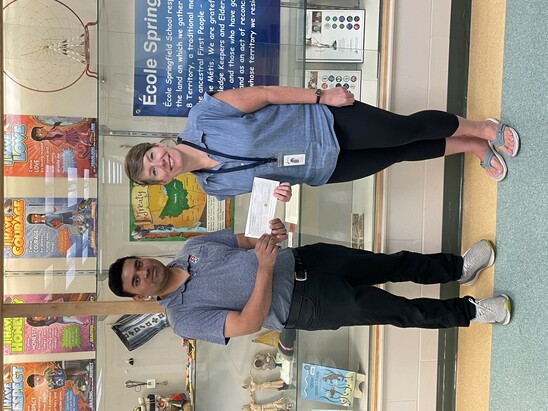 Photo with Dominos owner and cheque