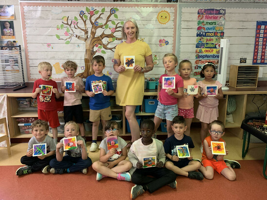 Photo of students with their art work