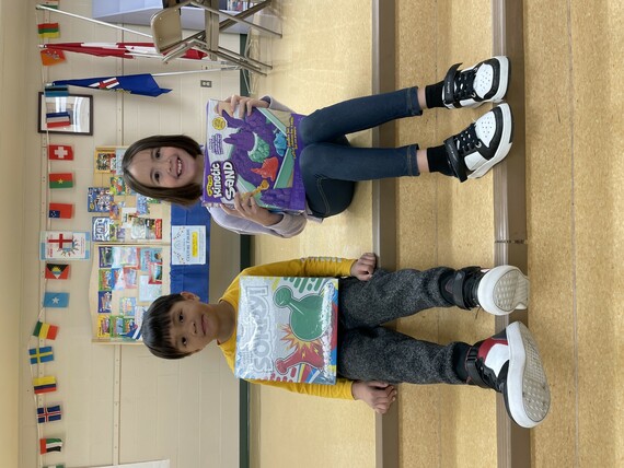 Photo of students holding their prizes