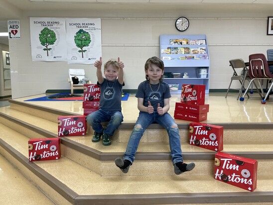 Photo of students with smile cookie boxes
