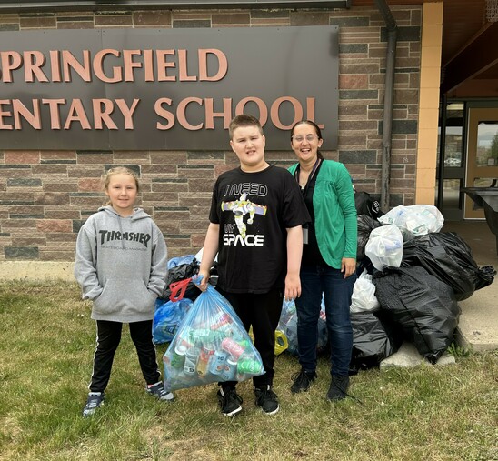 Photo of Students and EA with bottles